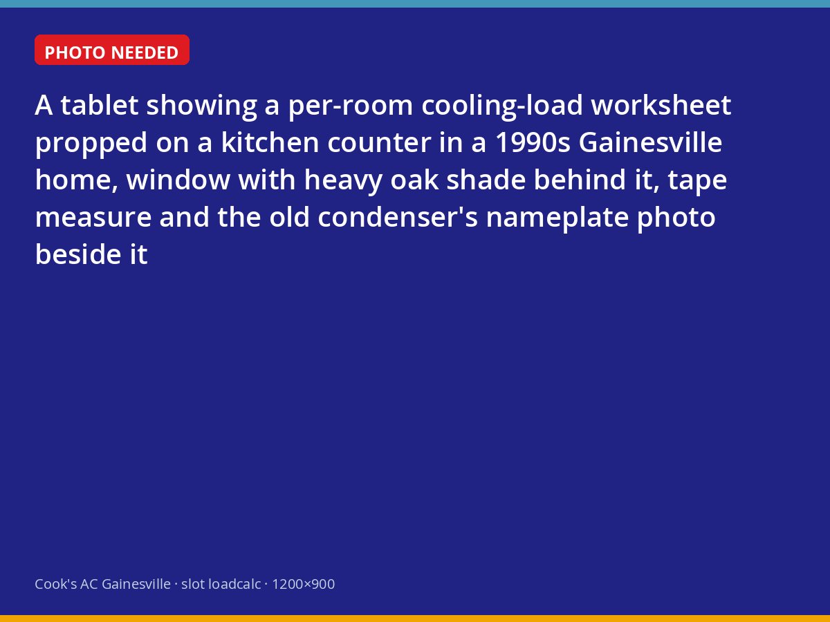 Load calculation on a tablet beside a window shaded by oaks